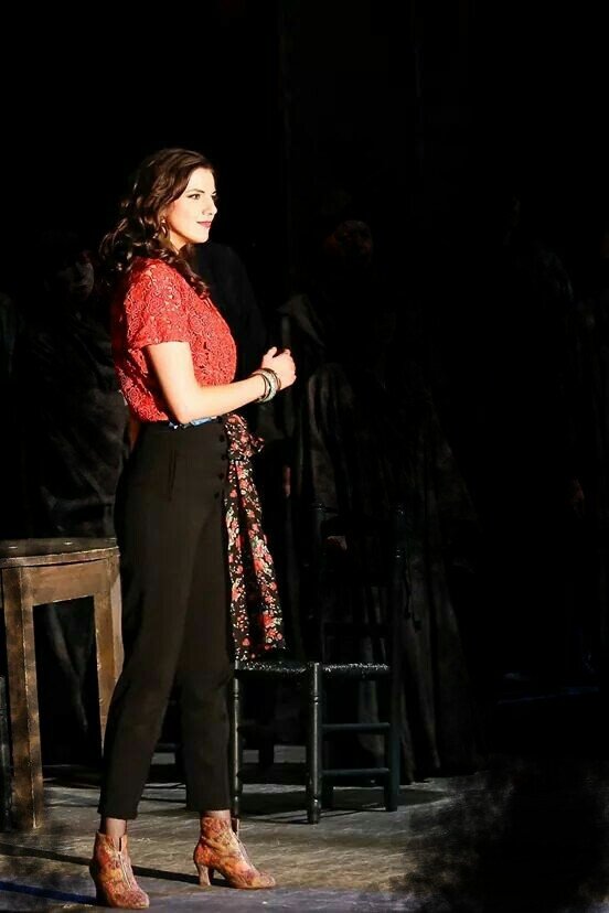 stage foto from Carmen as Carmen standing in pants